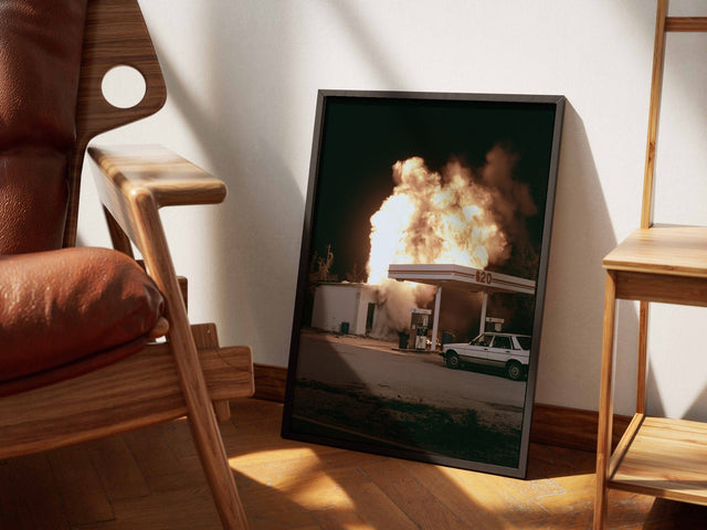 620 framed art beside a leather chair